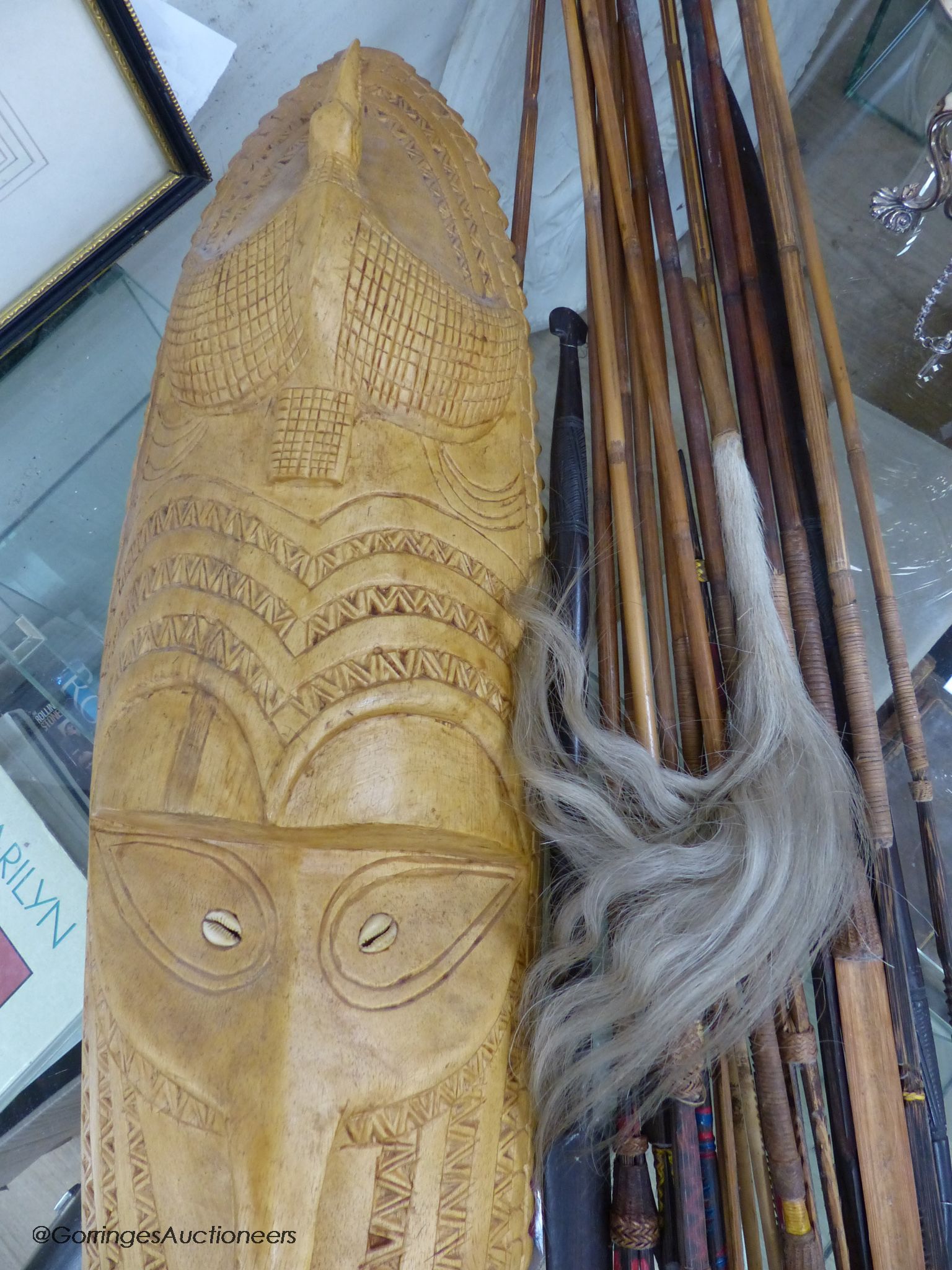 A collection of Tribal style spears etc and a mask